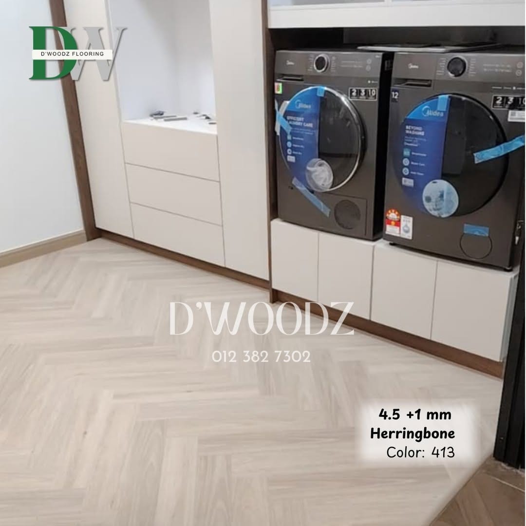 A utility room with a washer and dryer and white joinery on a pale herringbone floor; the D'Woodz watermark and product label in frame.